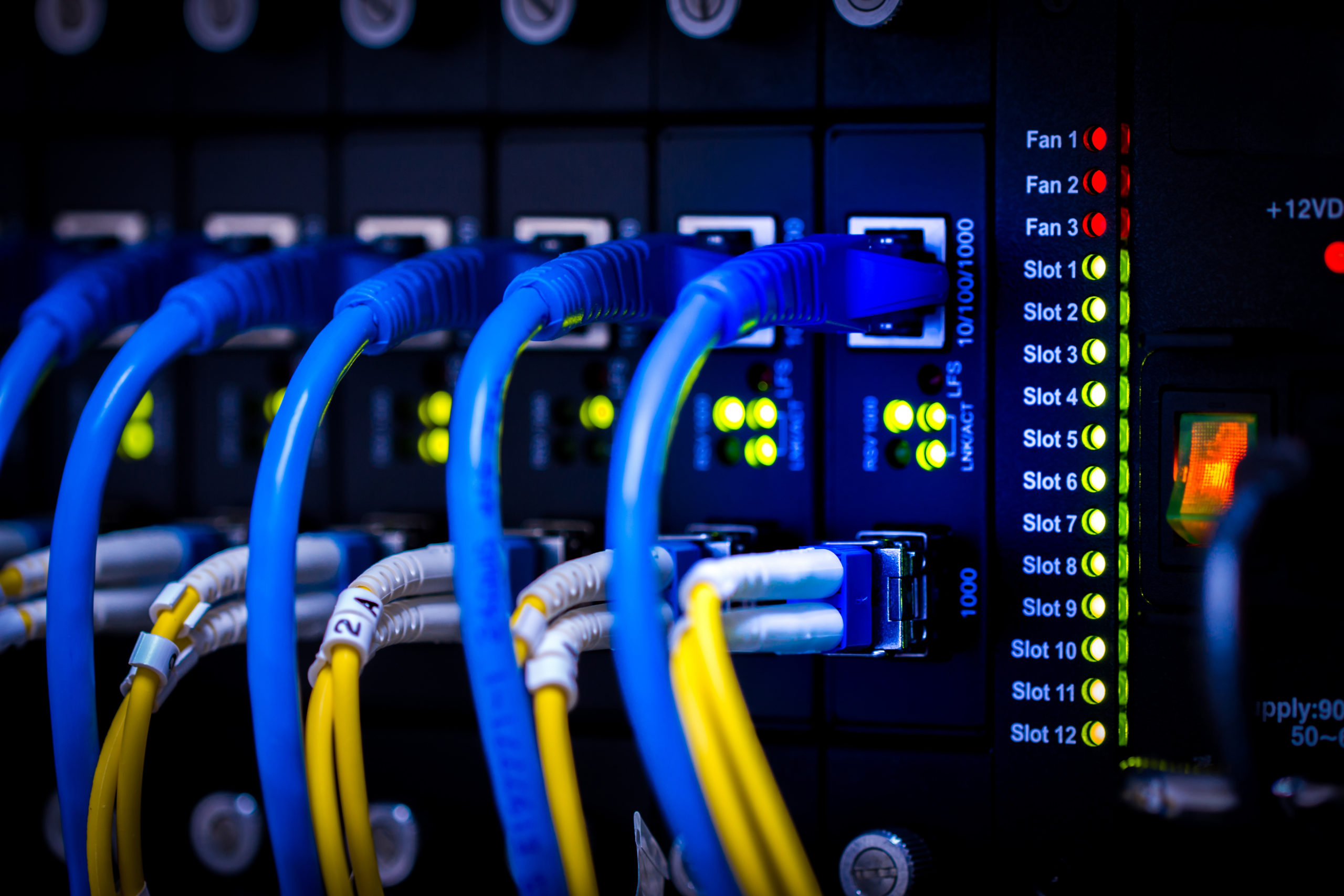 fiber optic network cables installed in a server rack
